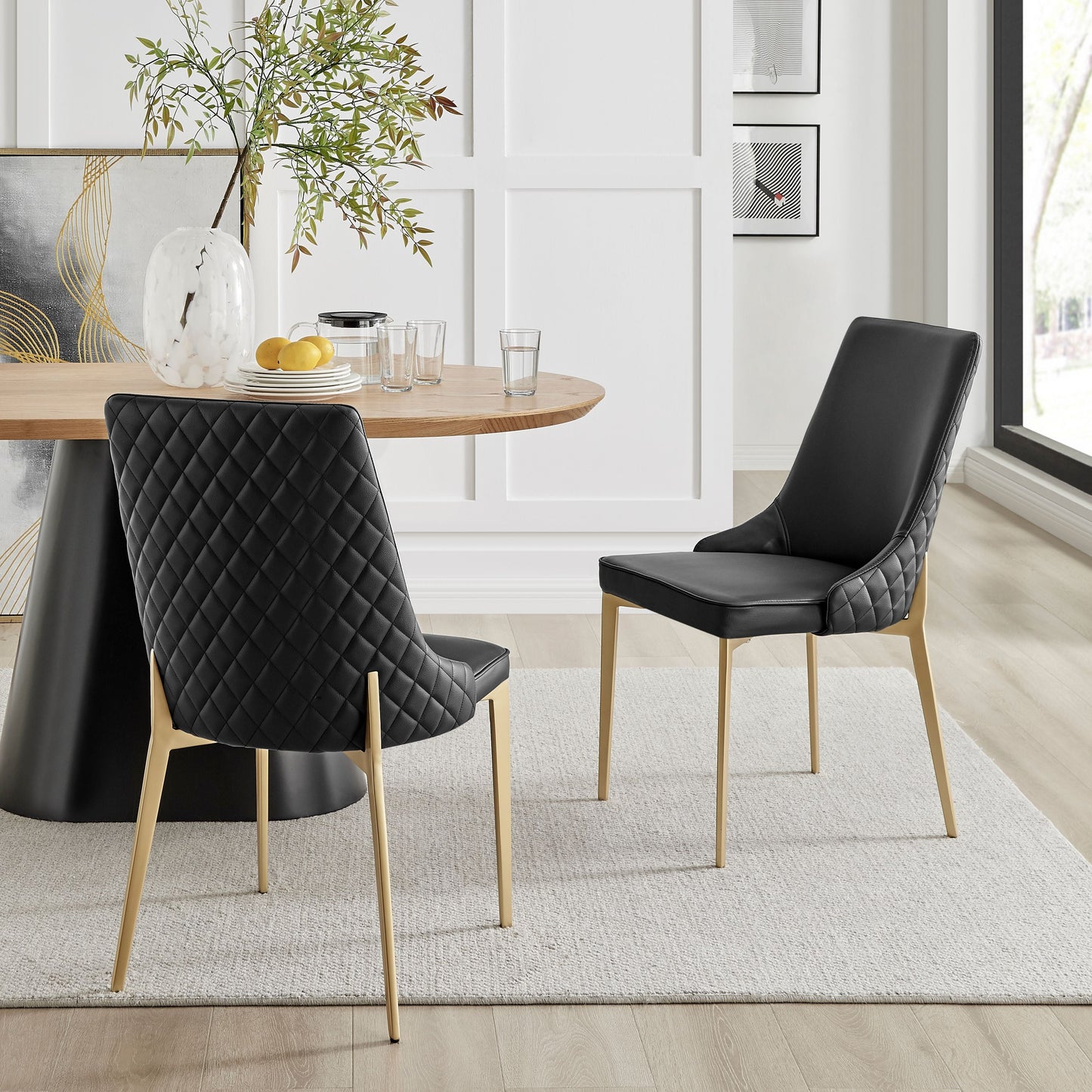 Chaise de salle à manger noire Jade en similicuir avec pieds dorés