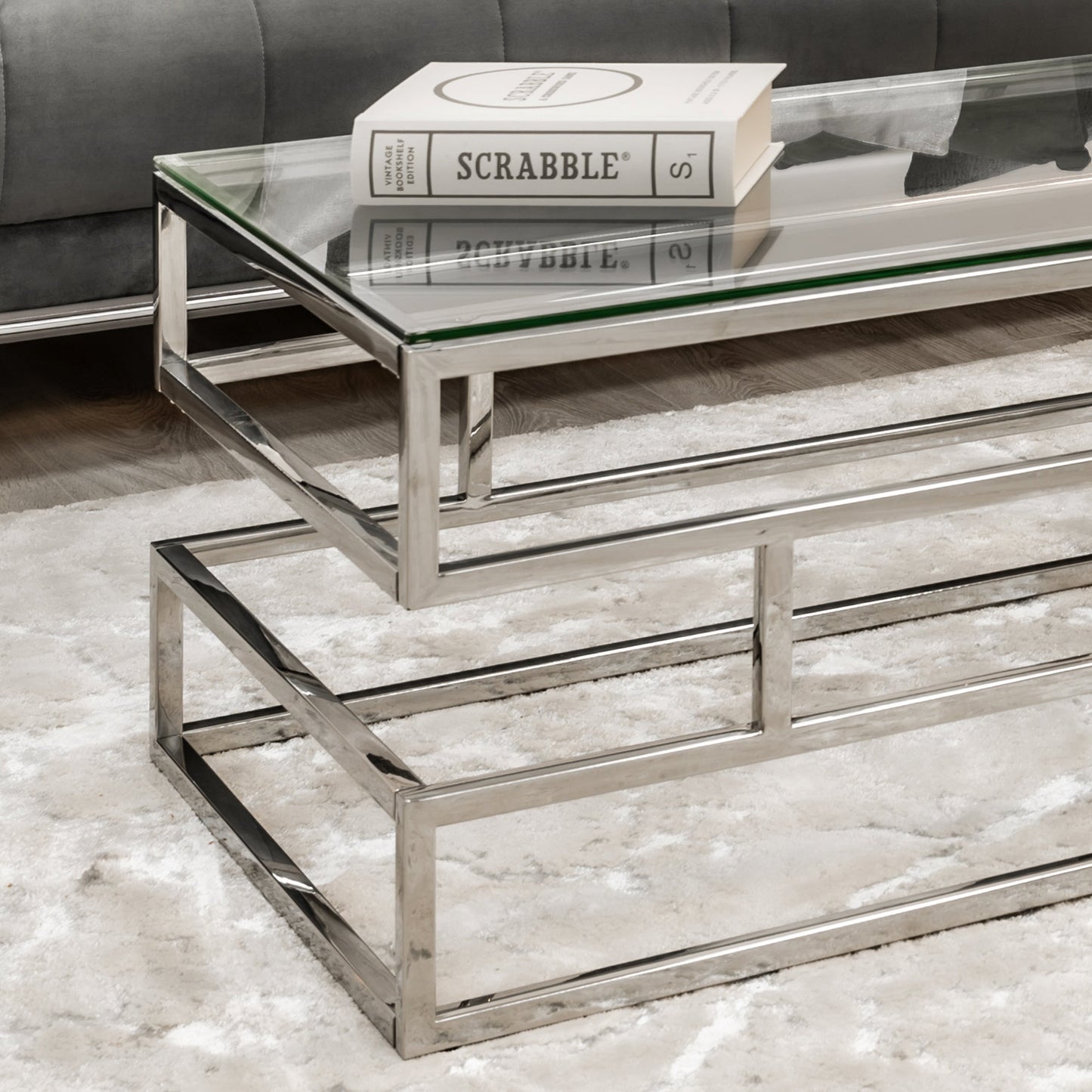 Table basse Lina en verre transparent avec cadre argenté