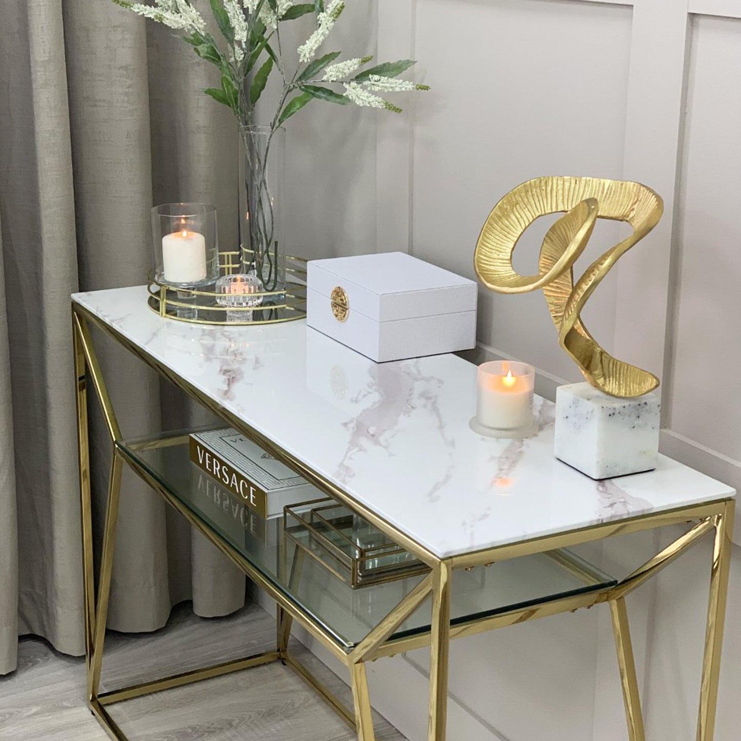 Console Ava Gold avec plateau effet marbre blanc