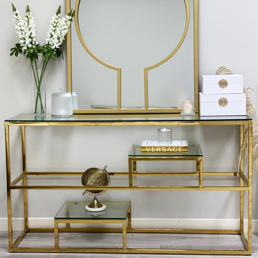 Console Enzo Gold avec plateau en verre transparent et étagères