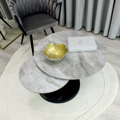 Table basse pivotante en céramique grise effet marbre avec base noire