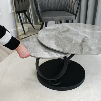 Table basse pivotante en céramique grise effet marbre avec base noire